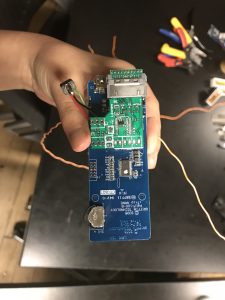 Hand holding the iTrip circuit board